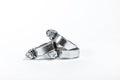 New metal hose clamps with threaded connection for pipes, stainless steel, small size on isolated white background close-up
