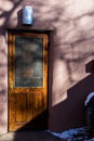 New Mexico Rustic door with stucko wall and some snow Royalty Free Stock Photo