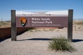 Entrance sign for White Sands National Park on a sunny day