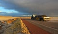 NEW MEXICO, USA - NOVEMBER 22, 2019: car on the road during a red sunset and thunderclouds on the background of the Guadalupe Royalty Free Stock Photo