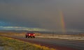 NEW MEXICO, USA - NOVEMBER 22, 2019: car on the road during a red sunset and thunderclouds on the background of the Guadalupe Royalty Free Stock Photo