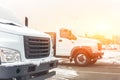 New middle size trucks at dealership parking outdoors at winter. Truck service and maintenance. Delivering and warehouse service Royalty Free Stock Photo