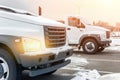 New middle size trucks at dealership parking outdoors at winter. Truck service and maintenance. Delivering and warehouse service Royalty Free Stock Photo
