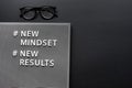 New mindset new result text on dark background Royalty Free Stock Photo