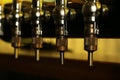 New modern beer taps in pub. Professional bar equipment Royalty Free Stock Photo