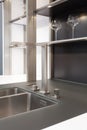 New modern black and white kitchen with chrome water tap and rectangular designer kitchen sink. Royalty Free Stock Photo