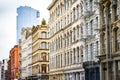 New modern building rises above the old historic buildings in Soho New York City