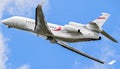 New modern Dassault Falcon 8X business jet plane taking off from the runway of Le Bourget airport to fly at Paris Air Show. France Royalty Free Stock Photo