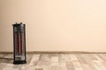 New modern electric heater on floor in room, space for text Royalty Free Stock Photo