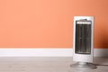 New modern electric heater on floor in room, space for text Royalty Free Stock Photo