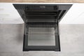 New modern electric oven built in black with screen, convention and grill, empty and open Royalty Free Stock Photo