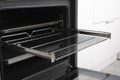 New modern electric oven built in black with screen, convention and grill, empty and open Royalty Free Stock Photo