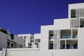 New modern facade white apartment building exterior architecture in blue summer sky Royalty Free Stock Photo