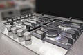 New modern gas stove with four burners for the kitchen, stainless steel surface Royalty Free Stock Photo
