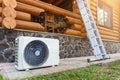 New modern HVAC air conditioning external compressor unit preapred for installation or replacement near wall of wooden