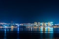 New modern Illuminated buildings reflected in sea bay surface at night in Gelendzhik, copy space