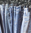 New modern jeans on hanger New fashion collection at fashionable clothes store Royalty Free Stock Photo