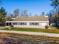 New modern lakefront home with on a sunny day Royalty Free Stock Photo