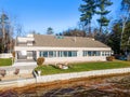 New modern lakefront home with on a sunny day Royalty Free Stock Photo