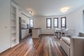 New modern living room with kitchen. New home. Interior photography. Wooden floor.