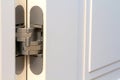 New modern metal door hinges on white wooden doors Royalty Free Stock Photo