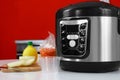 New modern multi cooker and products on table Royalty Free Stock Photo