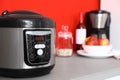 New modern multi cooker on table in kitchen Royalty Free Stock Photo