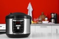 New modern multi cooker on table in kitchen Royalty Free Stock Photo