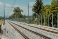 New modern railway track, freshly built, sound barrier wall is about to be raised and built. Sunny day Royalty Free Stock Photo