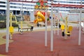New modern safe outdoor playground in the open air with exercise equipment and toys in a new district of the city in the courtyard Royalty Free Stock Photo