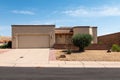 New modern Southwestern style house with flat roof, stucco home with xeriscape landscaping. Royalty Free Stock Photo