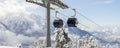 New modern spacious big cabin ski lift gondola against snowcapped forest tree and mountain peaks covered in snow Royalty Free Stock Photo