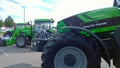 New modern tractors Deutz Fahr in agricultural machinery exhibition. Production and supply machines for farmers business.