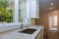 New modern white kitchen with built chrome water tap