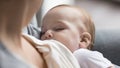 New mom breastfeeding calm peaceful sleepy infant with closed eyes