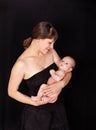 New mom spends quality time with baby boy. Joyful mommy carrying baby Royalty Free Stock Photo