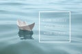 New Monday, New Week, New Goals - motivational quote. White paper boat floating on water surface Royalty Free Stock Photo