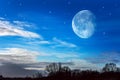 Starry sky with half moon in scenic cloudscape . Royalty Free Stock Photo