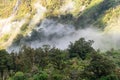 A new morning dawning at Doutful Sound, clouds hanging low in the mountains, Fiordland National Park, New Zealand