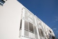 New multi-family block with balconies and bright on blue sky Royalty Free Stock Photo