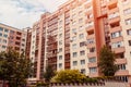 New multi-storey residential building with car parked in front. Modern house Royalty Free Stock Photo