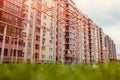 New multi-storey residential building. Sports ground with lawn in front of the house