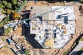 Construction workers pouring wet concrete into floor slab form. aerial top view Royalty Free Stock Photo