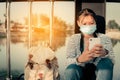New normal asian girl using smartphone searching the location to travel during the coronavirus outbreak, safe and health care