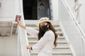 New normal of Asian young woman wearing protective mask holding passport ready to trevel at airplane