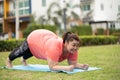 New normal concept,Young woman is happy to motivation exercise or yoga outdoor in the garden to control or lose weight.Obese fat