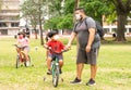 New Normal family ridding a bike in the pandemic