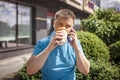 New normal reality, stay safe in street cafe, kids with medical mask waiting for breakfast Royalty Free Stock Photo