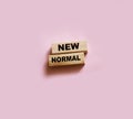 New normal words on wooden blocks. Business economy environment behavior concept Royalty Free Stock Photo