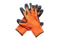 Nylon orange work gloves with black latex coating lying on top of each other with the working side down. Isolated on white bac